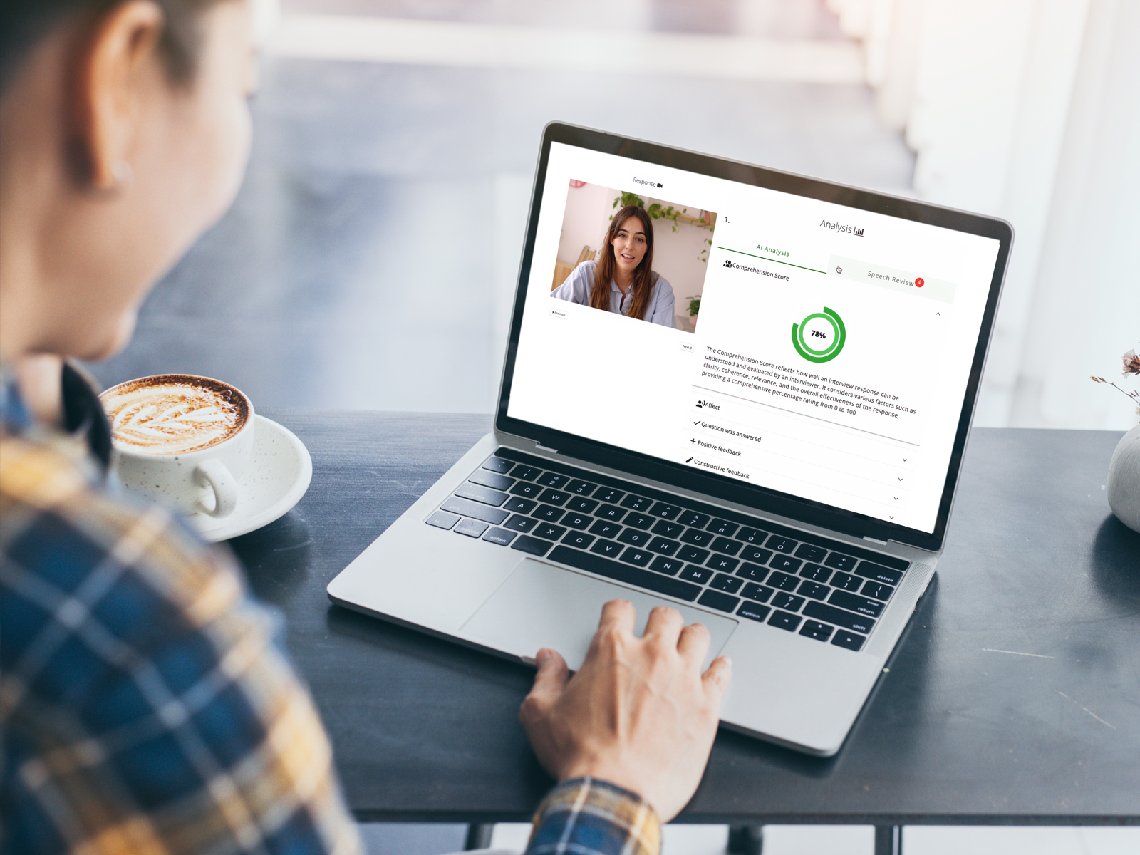 an excited woman using a laptop