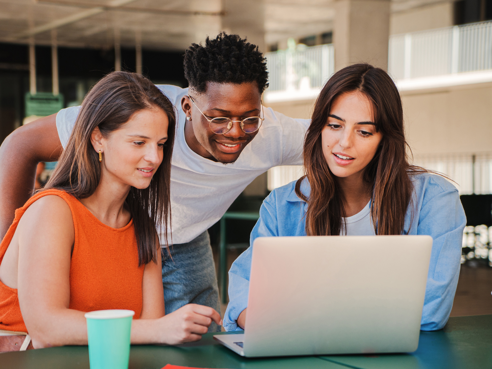 group of people at a laptop