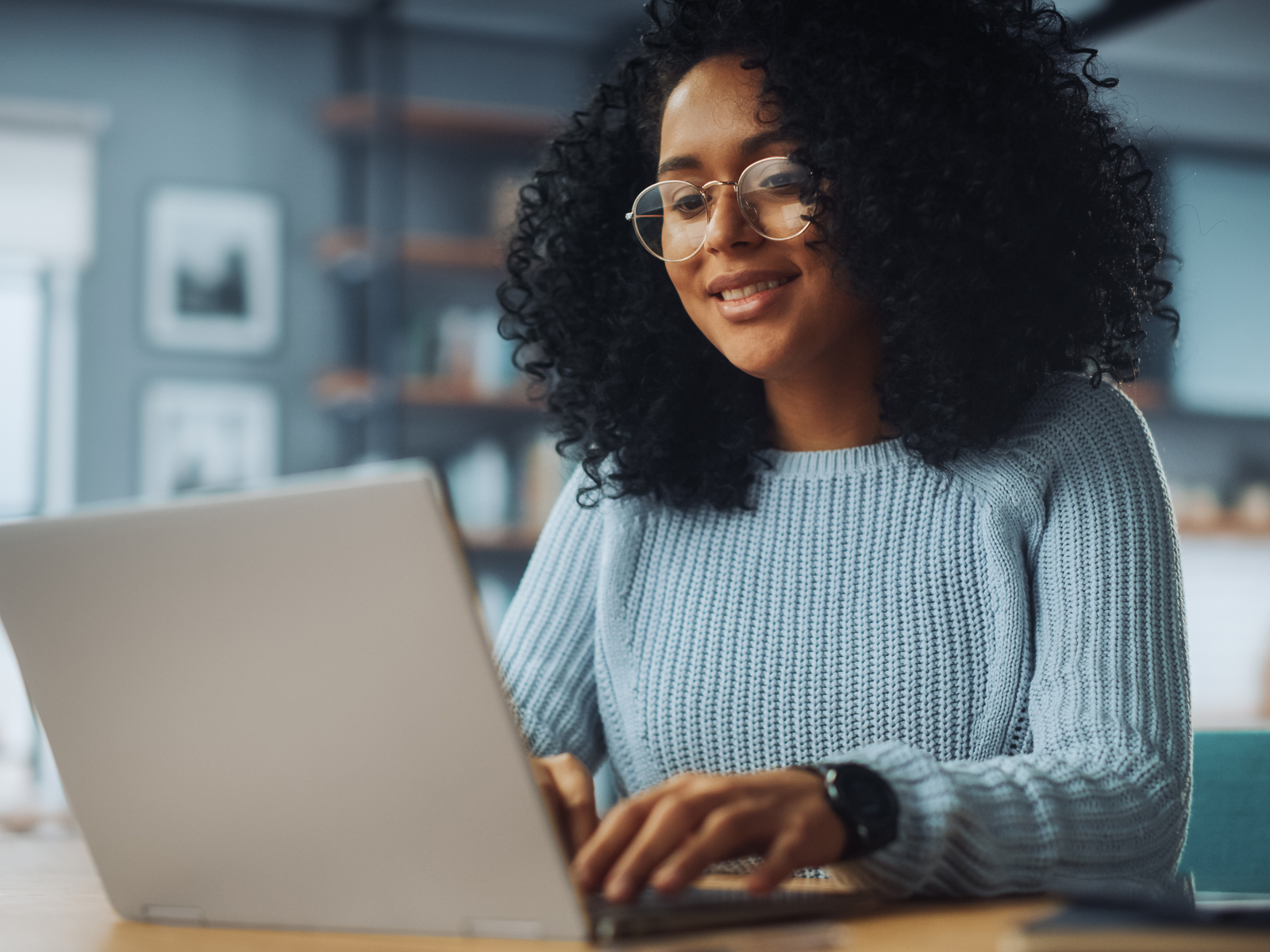 woman typing on laptop