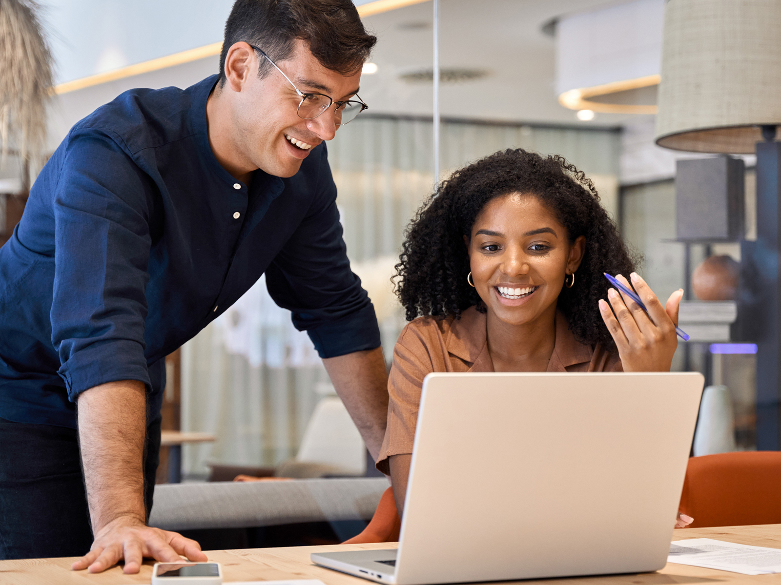 two people at a laptop